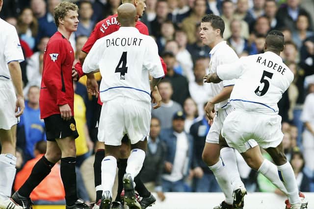 FLARE UPS: Rio Ferdinand acts as peacemaker between Leeds United's Ian Harte and Manchester United's Ole Gunnar Solskjaer during the FA Barclaycard Premiership game at Elland Road on September 14, 2002. Photo by Laurence Griffiths/Getty Images.