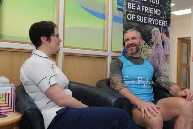 Jamie Peacock MBE, chats with physiotherapist Rhea Sutcliffe at the Sue Ryder Wheatfields Hospice in Leeds.
The rugby league legend has twice taken on the challenge of the Virgin Money London Marathon in memory of his dad Darryl and in support of the hospice in Leeds. Picture Tony Johnson.