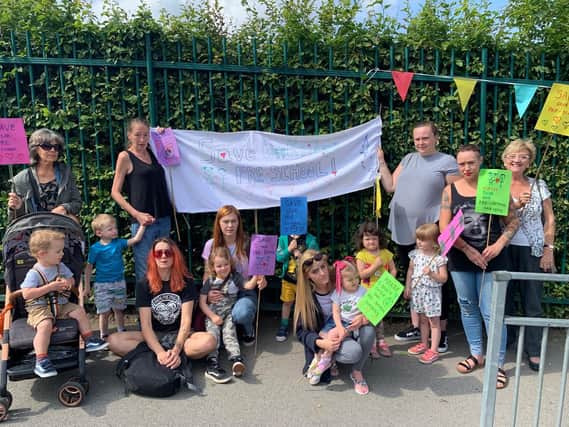 Parents and children outside Cookridge Pre School after they were told the nursery was being evicted from the premises last week