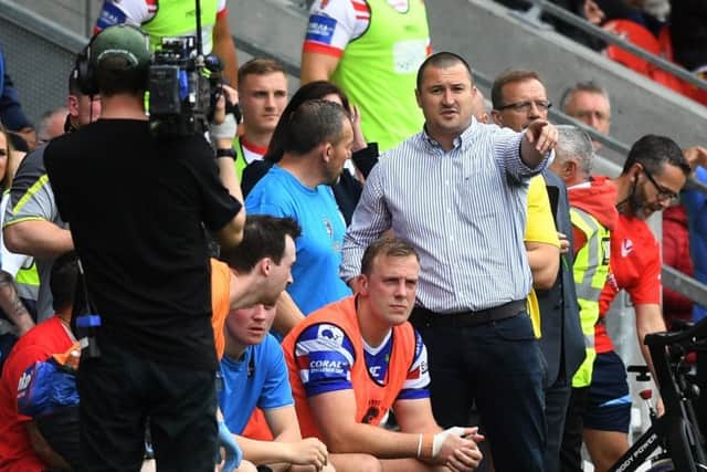 Wakefield Trinity head coach Chris Chester with Craig Kopczak in the foreground.