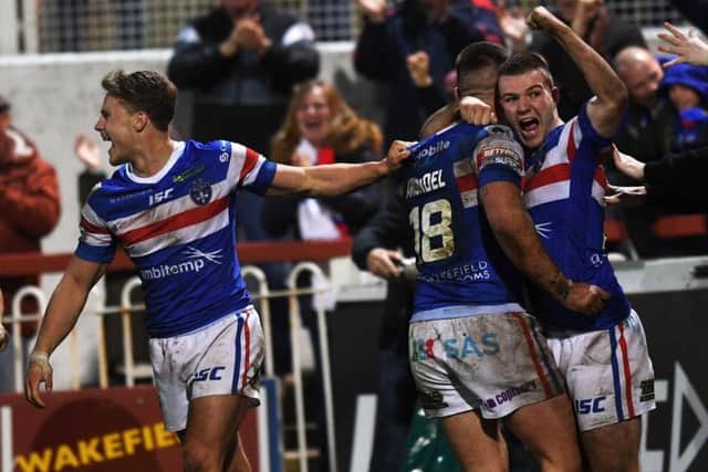 Wakefield's Joe Arundel celebrates his a try with Max Jowitt.