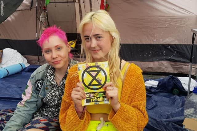 Protester Annwen Thurlow (right), aged 16, with her friend Tait (left), aged 17.