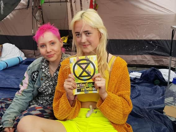 Protester Annwen Thurlow (right), aged 16, with her friend Tait (left), aged 17.