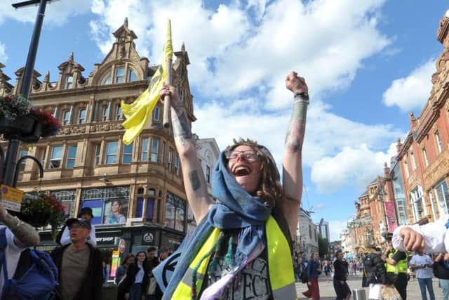 Protester leading the Extinction Rebellion march.