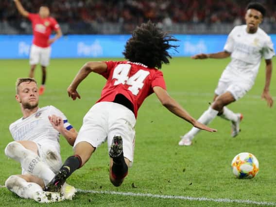 TOO GOOD: Manchester United's Tahith Chong is taken out by Leeds United skipper Liam Cooper in Wednesday's pre-season friendly in Perth. Picture by Will Russell/Getty Images.