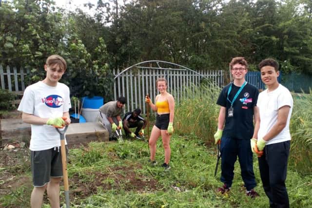 A group of NCS volunteers during their work day in Killingbeck.