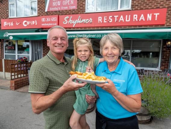 Elaine Coyne (right) with Skyliner former owner David Meehan, and Elaine's granddaughter Martha Coyne, five, who went on a school trip to the Skyliner Fish and Chip Restaurant, in Whitkirk, Leeds.