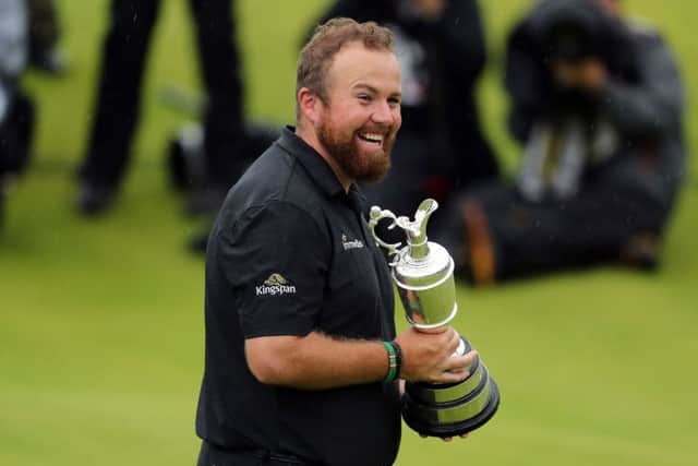 TOP OF THE WORLD: Shane Lowry celebrates winning the Claret Jug at The Open at Royal Portrush. Picture: Niall Carson/PA