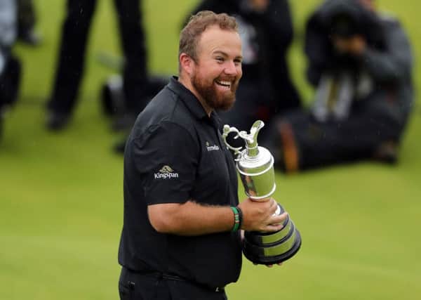 TOP OF THE WORLD: Shane Lowry celebrates winning the Claret Jug at The Open at Royal Portrush. Picture: Niall Carson/PA