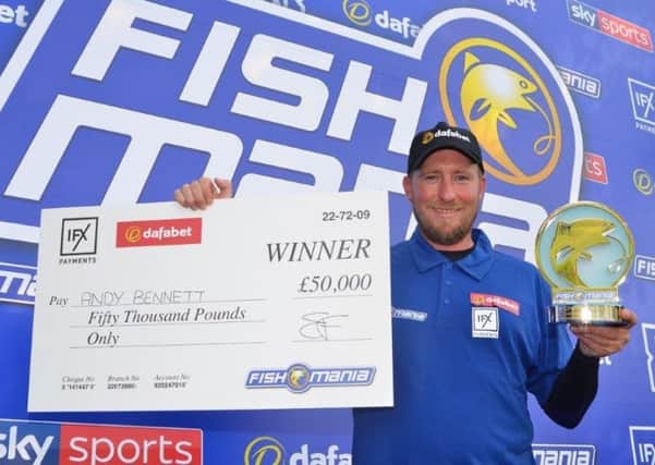 Andy Bennett, with his £50,000 prize for winning Fish'O'Mania 2019.