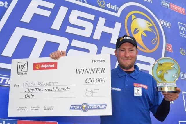 Andy Bennett, with his £50,000 prize for winning Fish'O'Mania 2019.