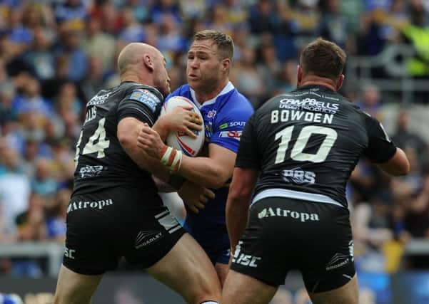NO WAY THROUGH: Leeds Rhinos' Trent Merrin is tackled by Hull's Gareth Ellis and Josh Bowden.   Picture: Tony Johnson.