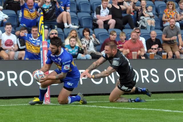 COMEBACK: Leeds Rhinos' Tom Briscoe scores his second try against Hull FC at Headingley on Sunday. Picture: Tony Johnson.