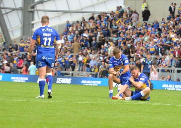 Leeds Rhinos players show their frustration after the defeat to Hull FC.