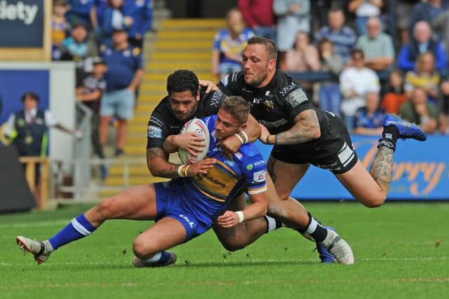 Jack Walker is tackled by Hull's Bureta Faraimo and Josh Griffin.