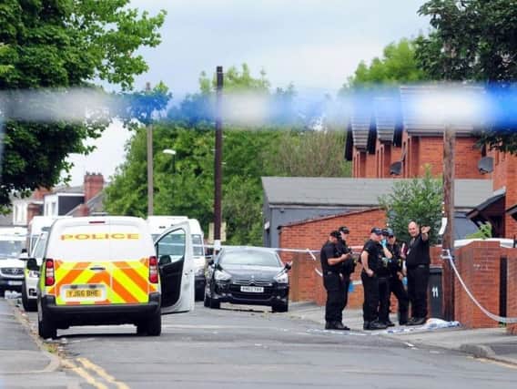 Police at the scene in Reginald Street, Chapeltown, following the fatal shooting.