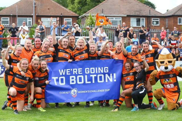 Castleford Tigers women celebrate their semi-final victory over Wakefield Trinity.