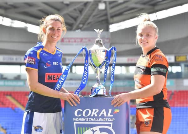Leeds Rhinos Courtney Hill, left, and Castleford Tigers Georgia Roche are pictured with the Womens Challenge Cup.