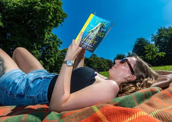 Date:23rd July 2019.
Picture James Hardisty.
Heatwave across the UK with forecaster predicting the temperatures are expected to hit 37C (98.6F) in South East England. Pictured  paige Palmer, aged 25, from Australia, now working in Harrogate takes time out to enjoying the warm weather relaxing on The Stray in the centre of Harrogate.