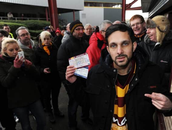 Bradford Magician Dynamo joins fans in the queue for tickets for the Capital One Cup semi final clash with Aston Villa in 2012. Picture by Bruce Rollinson.