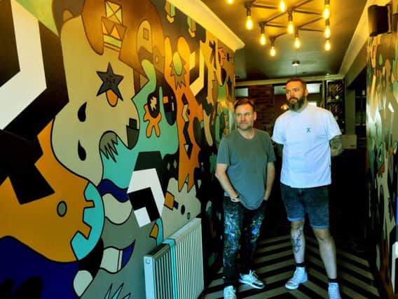 Artist Nicolas Dixon and chef Matt Healy, in the new entrance at The Beehive