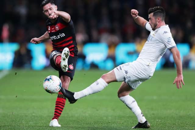Jack Harrison challenges Dylan McGowan of Western Sydney Wanderers. Picture: Getty Images.