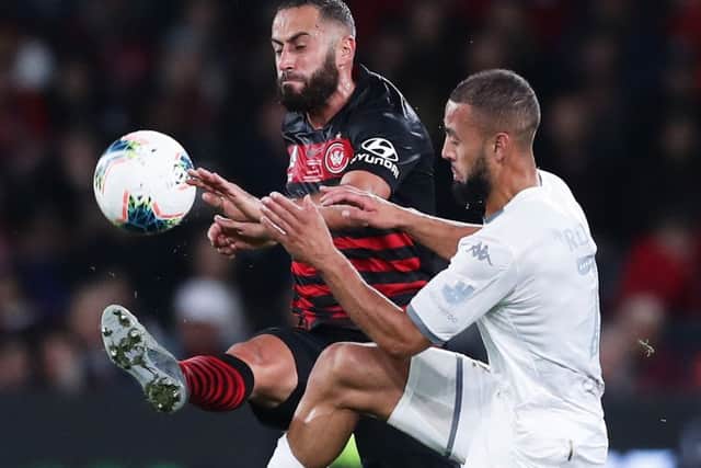 Kemar Roofe challenges Tarek Elrich of Western Sydney Wanderers last week. Picture: Getty Images.