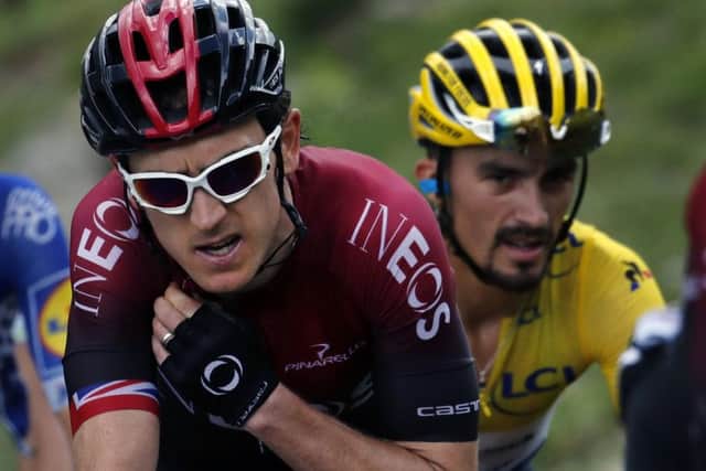 Britain's Geraint Thomas, left, and France's Julian Alaphilippe wearing the overall leader's yellow jersey, climb the Vars pass. (AP Photo/ Christophe Ena)