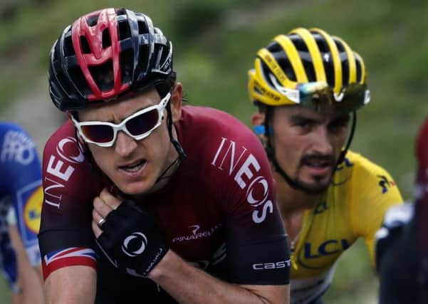 Britain's Geraint Thomas, left, and France's Julian Alaphilippe wearing the overall leader's yellow jersey, climb the Vars pass. (AP Photo/ Christophe Ena)
