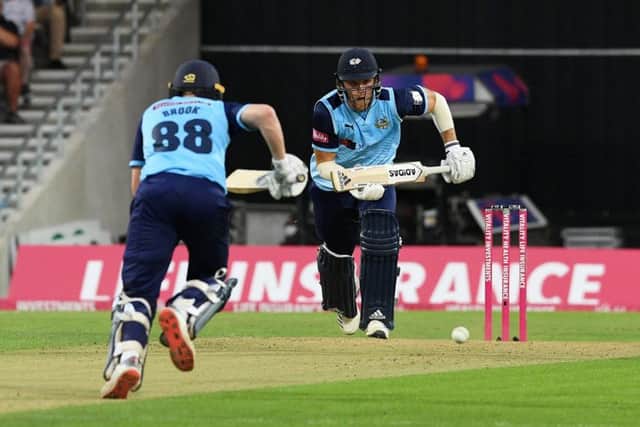 Yorkshire's David Willey chalks up the runs with Harry Brook against Lancashire. (Picture: Jonathan Gawthorpe)