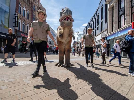 A roaming T-Rex exploring Leeds city centre.