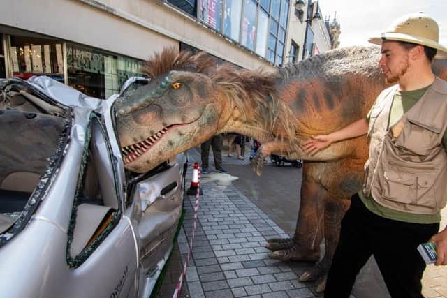 A roaming T-Rex exploring Leeds city centre.