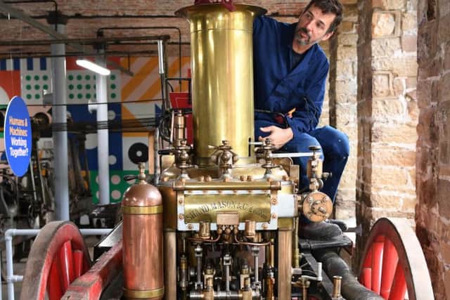 Engineer Andrew Bodley works on the City of Leeds fire engine from 1891. Picture: Jonathan Gawthorpe