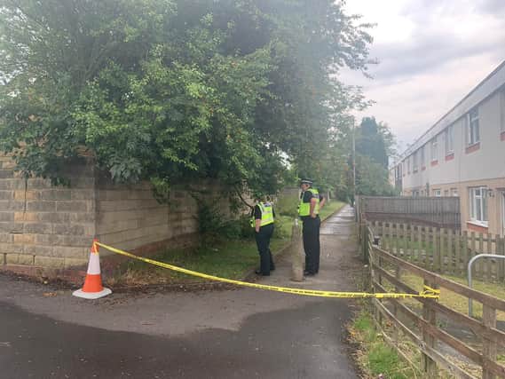 Police have cordoned off a path in Whinmoor