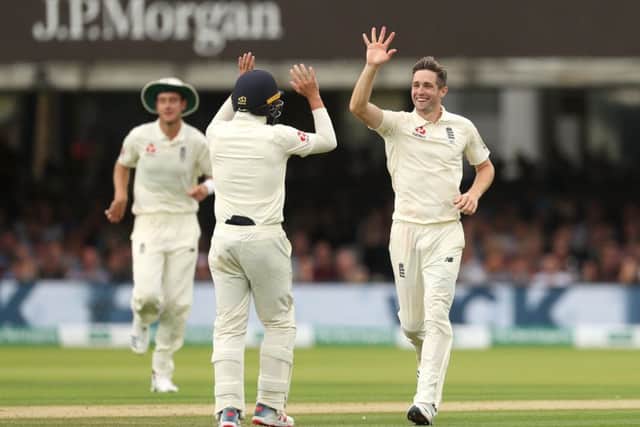 England's Chris Woakes (right) celebrates the dismissal of Ireland's Stuart Thompson during day three at Lord's. Picture: Bradley Collyer/PA