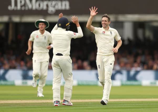 England's Chris Woakes (right) celebrates the dismissal of Ireland's Stuart Thompson during day three at Lord's. Picture: Bradley Collyer/PA