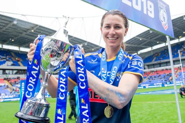 Leeds Rhinos' captain Courtney Hill  with the Coral Women's Challenge Cup trophy after yesterday's victory over Castleford Tigers. Picture: SWPix.com.
