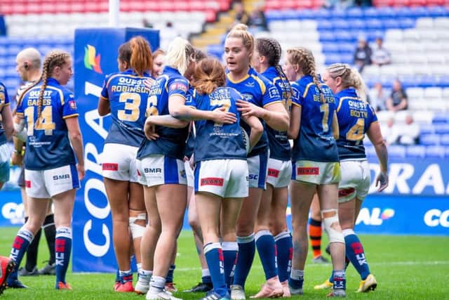 Leeds Rhinos players celebrate Courtney Hill's try against Castleford.