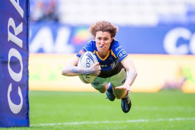 Courtney Hill dives over to score the match-winning try.