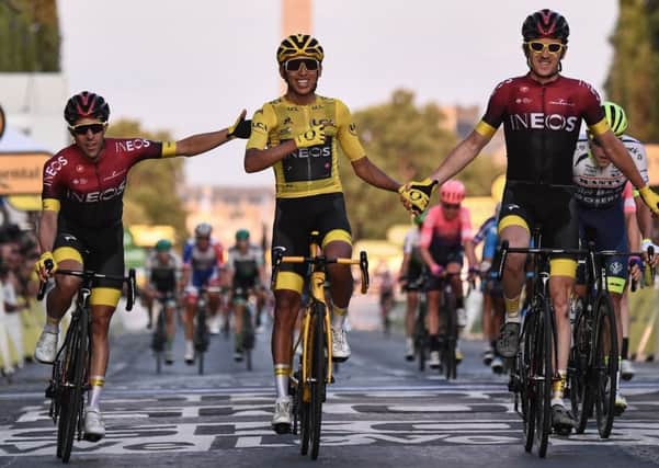 OVER THE LINE: Spain's Jonathan Castroviejo, left, and Great Britain's Geraint Thomas, right, congratulate Colombia's Egan Bernal as he celebrates his victory in the Tour de France. Picture: ANNE-CHRISTINE POUJOULAT/Getty Images