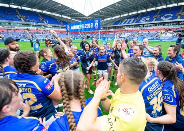 Leeds Rhinos celebrate in a huddle after victory over Castleford.