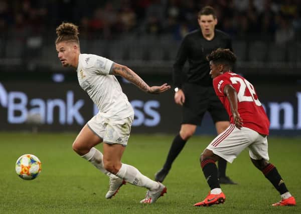 PERTH, AUSTRALIA - JULY 17: Kalvin Phillips of Leeds controls the ball agianst Angel Gomes of Manchester United during a pre-season friendly match between Manchester United and Leeds United at Optus Stadium on July 17, 2019 in Perth, Australia. (Photo by Paul Kane/Getty Images)