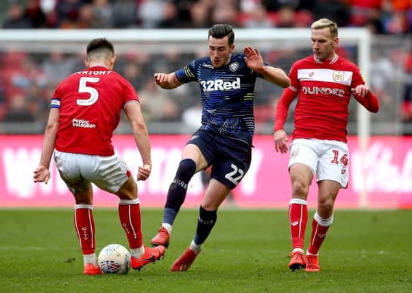 BRISTOL, ENGLAND - MARCH 09: Jack Harrison of Leeds United tackles with Bailey Wright and Andreas Weinmann of Bristol City during the Sky Bet Championship between Bristol City and Leeds United at Ashton Gate on March 09, 2019 in Bristol, England. (Photo by Jordan Mansfield/Getty Images)