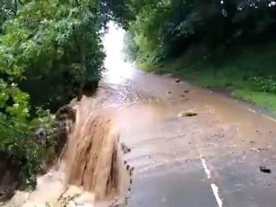The B6270 between Downhome and Grinton has eroded (Photo and video: Inspector Paul Cording / TC Grey, North Yorkshire Police).