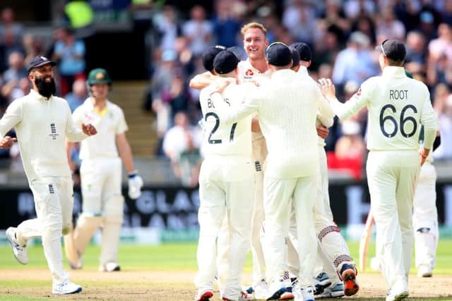 Got him: England's Stuart Broad celebrates taking the wicket of Australia's David Warner leg before.