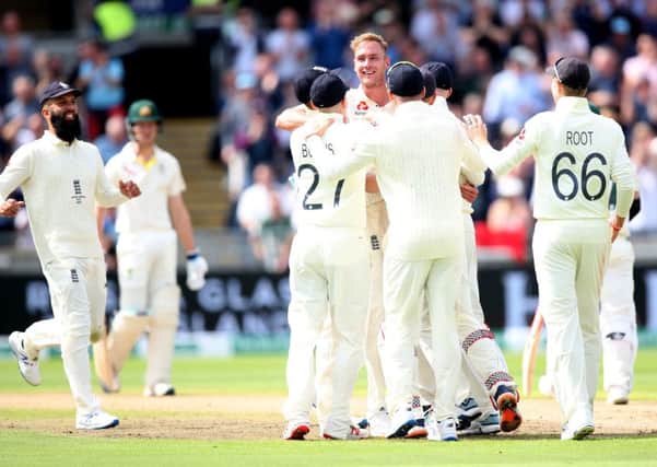 Got him: England's Stuart Broad celebrates taking the wicket of Australia's David Warner leg before.