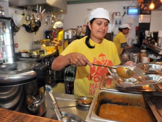 Manjit Kaur at work at Manjit's kitchen in Leeds Kirkgate Market in 2018.