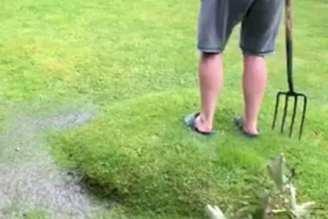 The blister appeared on the lawn in Ackworth after the recent torrential rain (Phot and video: Yvette McKinney /SWNS.COM).