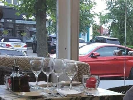 The silver BMW can be seen in the background if this photo taken in the Flying Pizza restaurant.
