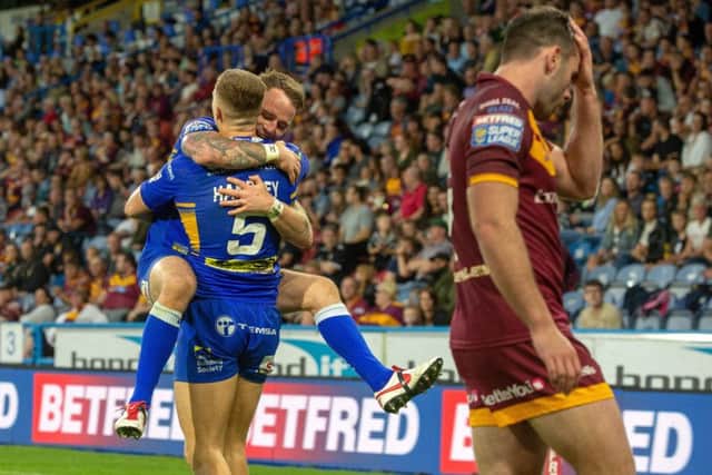Ash Handley celebrates scoring Leeds Rhinos' fifth try.